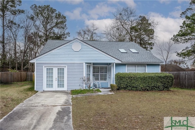 view of front of home featuring french doors and a front lawn