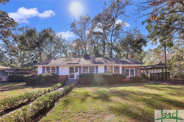 ranch-style house featuring a front lawn