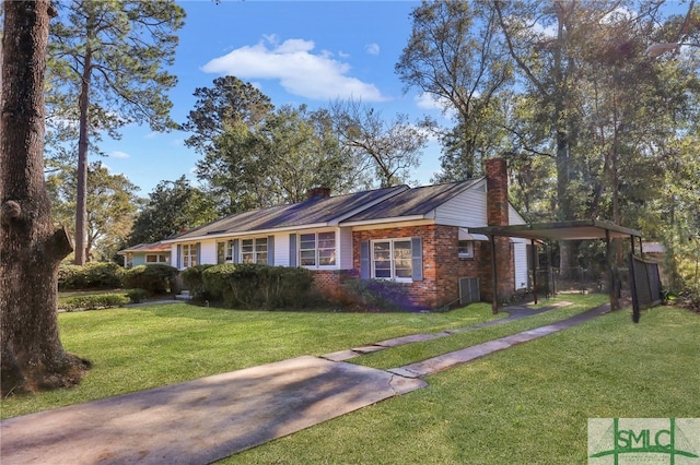 single story home with a front lawn and a carport