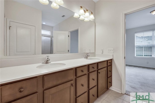 bathroom featuring tile patterned flooring and vanity