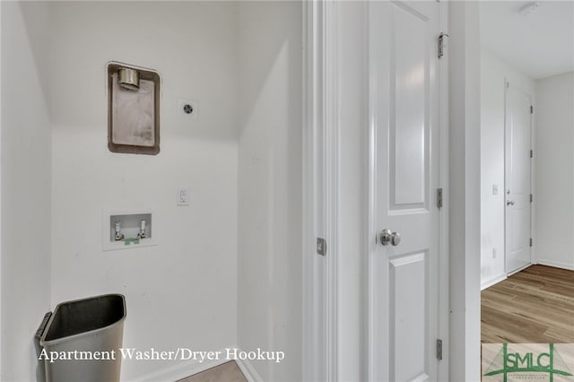 washroom featuring hookup for an electric dryer, hookup for a washing machine, and light hardwood / wood-style floors