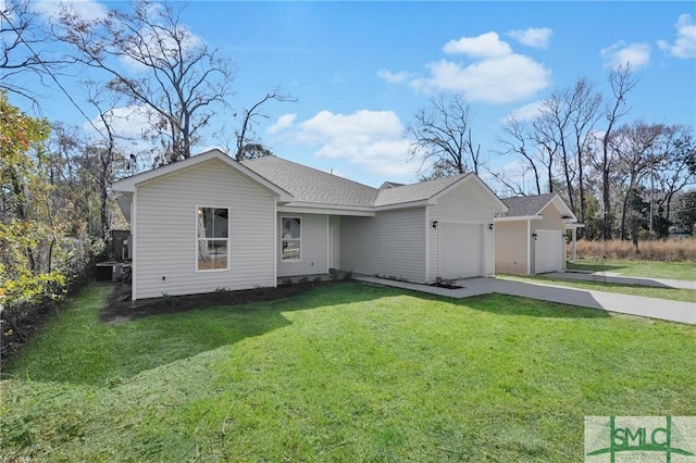 ranch-style home with a garage and a front lawn