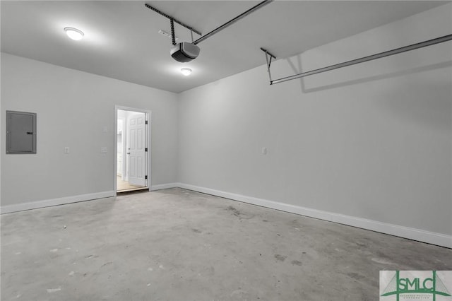 garage featuring a garage door opener and electric panel