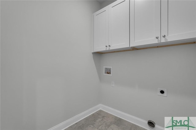 washroom featuring washer hookup, cabinets, and hookup for an electric dryer