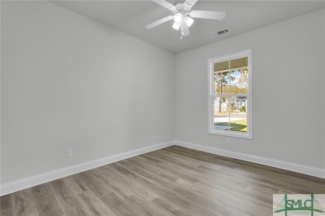 empty room featuring light hardwood / wood-style flooring and ceiling fan