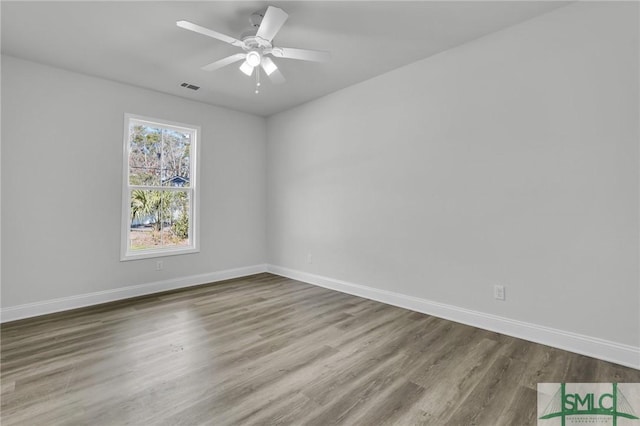 empty room with wood-type flooring and ceiling fan