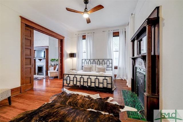 bedroom featuring wood-type flooring and ceiling fan