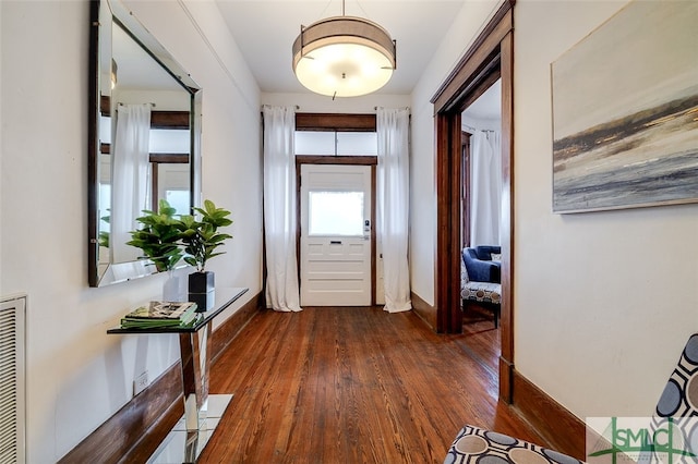 doorway featuring dark wood-type flooring