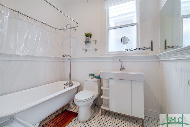 full bathroom with shower / tub combo, vanity, and toilet