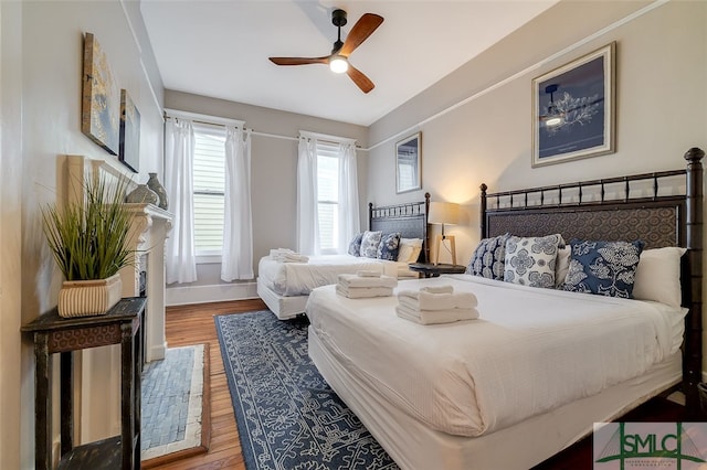 bedroom featuring ceiling fan and wood-type flooring