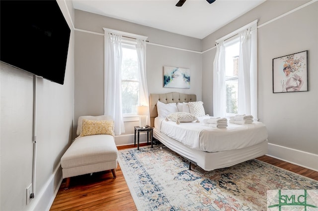 bedroom with hardwood / wood-style flooring and ceiling fan