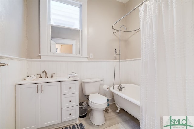 full bathroom with vanity, toilet, and shower / tub combo