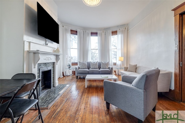 living room with hardwood / wood-style floors and a fireplace