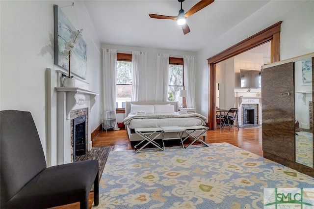 bedroom featuring wood-type flooring and ceiling fan