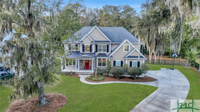 craftsman house featuring a porch and a front lawn