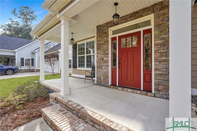 property entrance featuring a porch