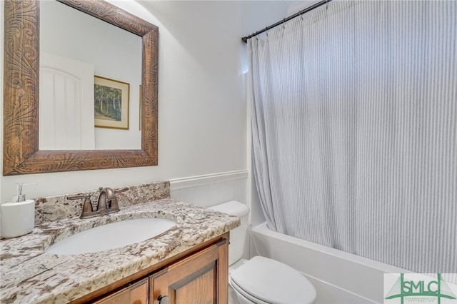 full bathroom featuring shower / tub combo, vanity, and toilet