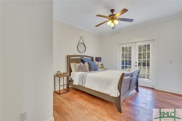 bedroom with hardwood / wood-style floors, access to outside, french doors, ceiling fan, and ornamental molding