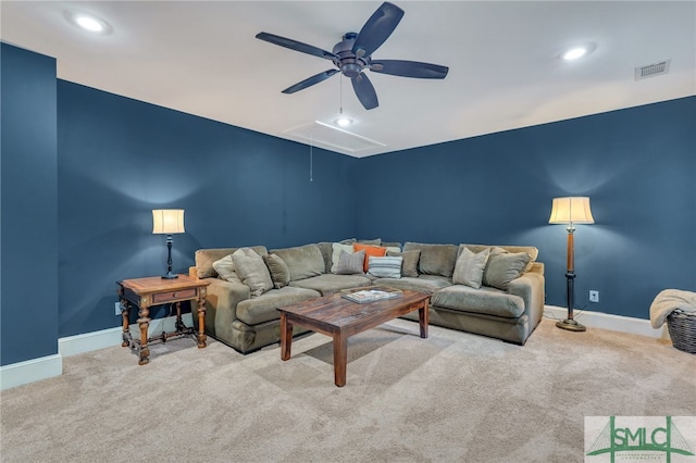 carpeted living room featuring ceiling fan