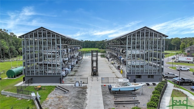 exterior space featuring a water view and a dock