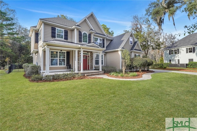 view of front of property featuring a front lawn and a porch