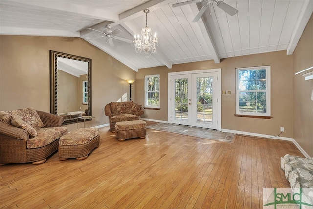 sitting room featuring an inviting chandelier, french doors, lofted ceiling with beams, wood-type flooring, and wood ceiling