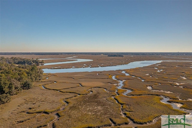 aerial view at dusk with a water view