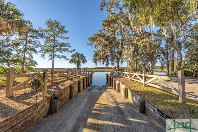 view of horse barn with a water view