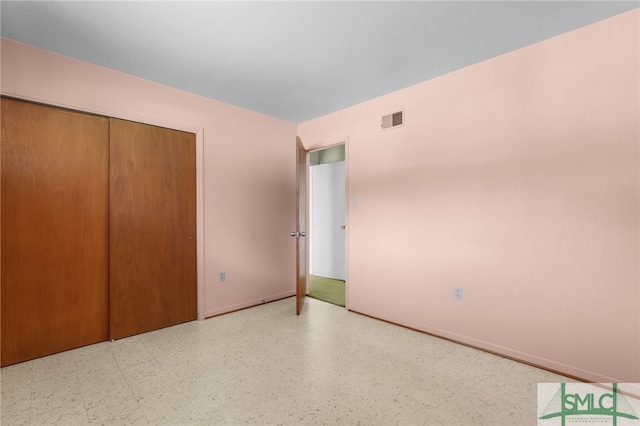 unfurnished bedroom featuring a closet