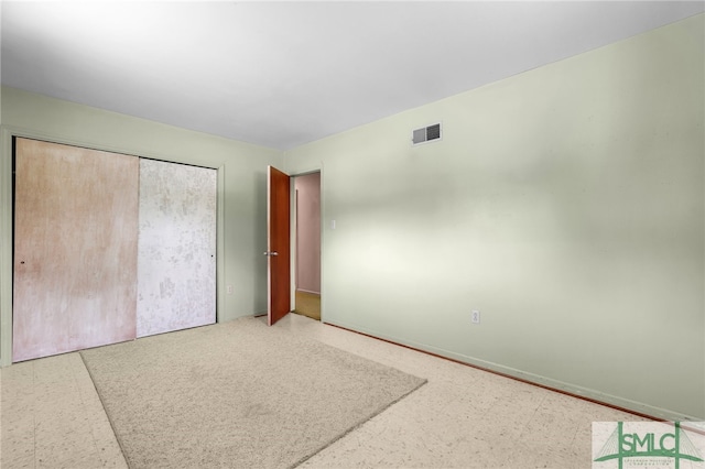 unfurnished bedroom featuring a closet