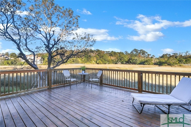 wooden deck featuring a water view