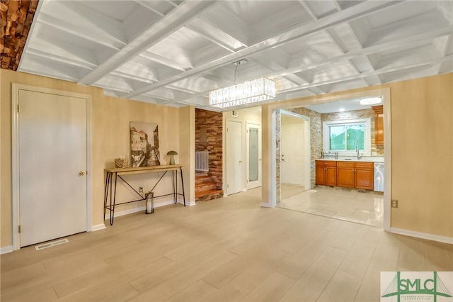 miscellaneous room with beamed ceiling, light wood-type flooring, and coffered ceiling