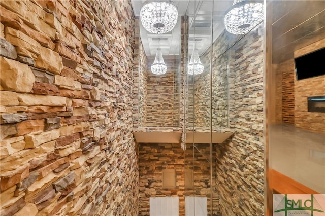 wine cellar with a notable chandelier