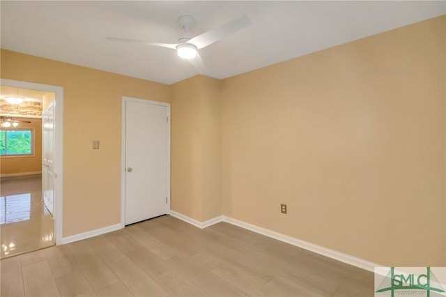 unfurnished bedroom with ceiling fan and light wood-type flooring