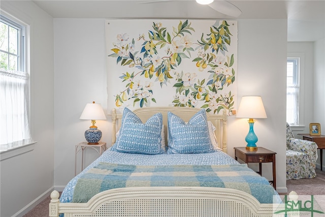 bedroom with ceiling fan and carpet floors