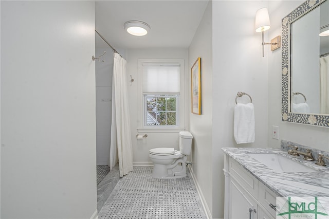 bathroom featuring vanity, toilet, and curtained shower