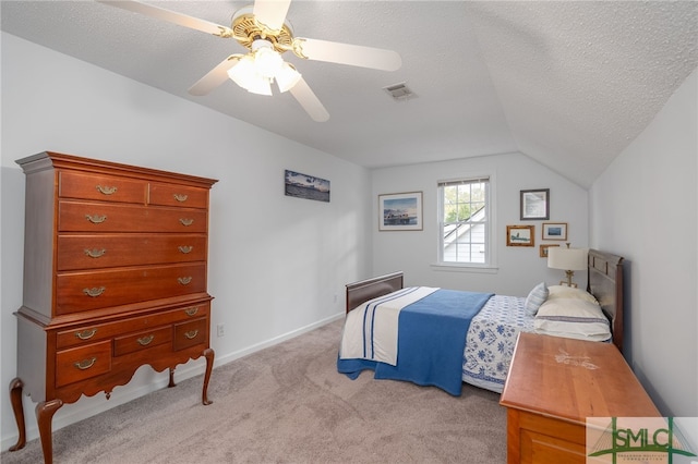 bedroom with a textured ceiling, light colored carpet, ceiling fan, and lofted ceiling