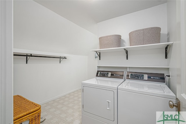 washroom featuring washer and clothes dryer