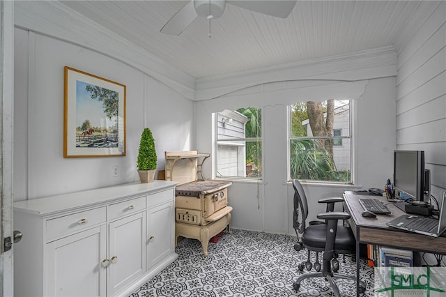 office featuring wooden walls, ceiling fan, and ornamental molding