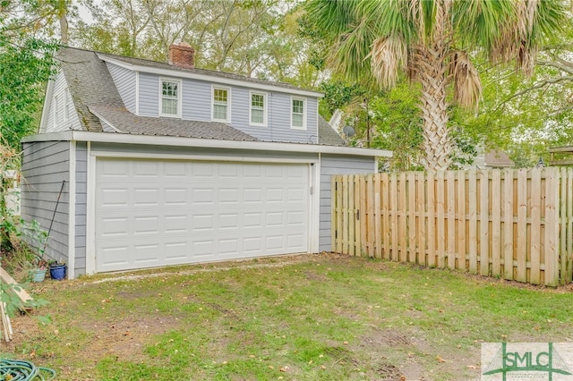 garage featuring a yard