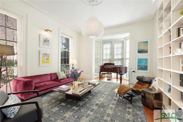 sitting room featuring hardwood / wood-style flooring and ornamental molding