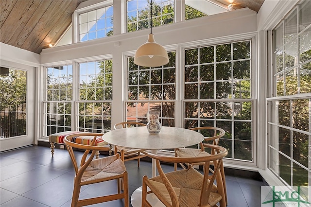 sunroom / solarium featuring wooden ceiling and vaulted ceiling