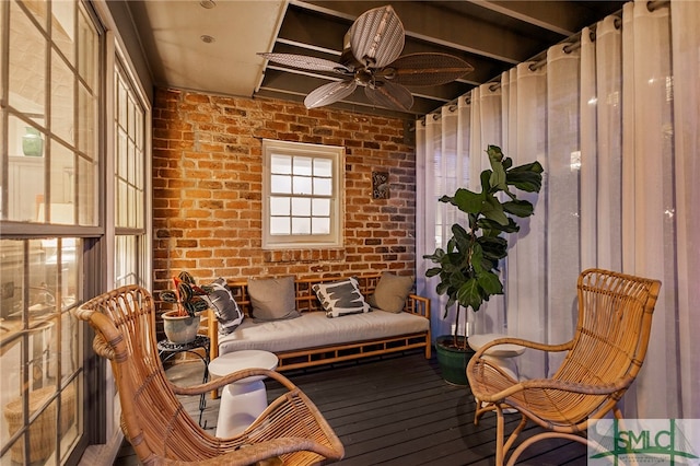 sunroom / solarium with ceiling fan