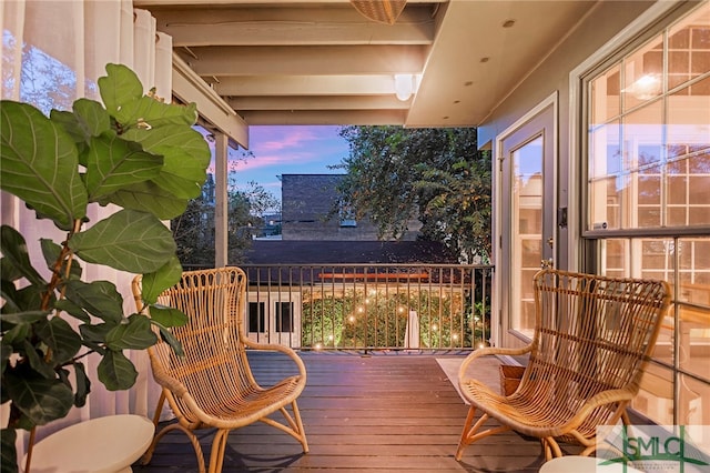 view of balcony at dusk