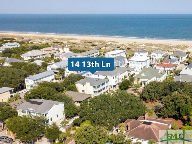 bird's eye view featuring a water view and a view of the beach