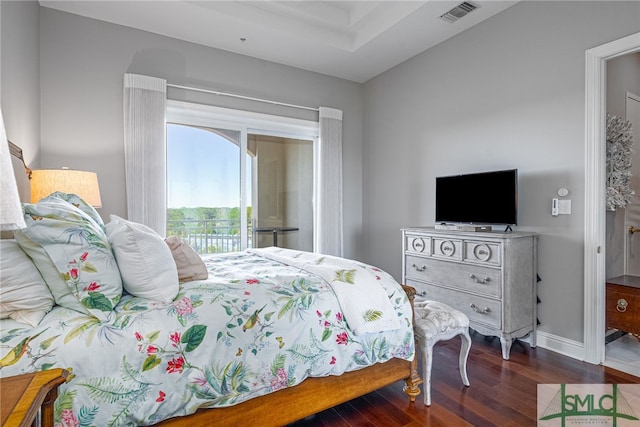 bedroom with dark hardwood / wood-style flooring and access to outside