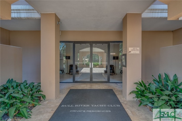 property entrance featuring a patio