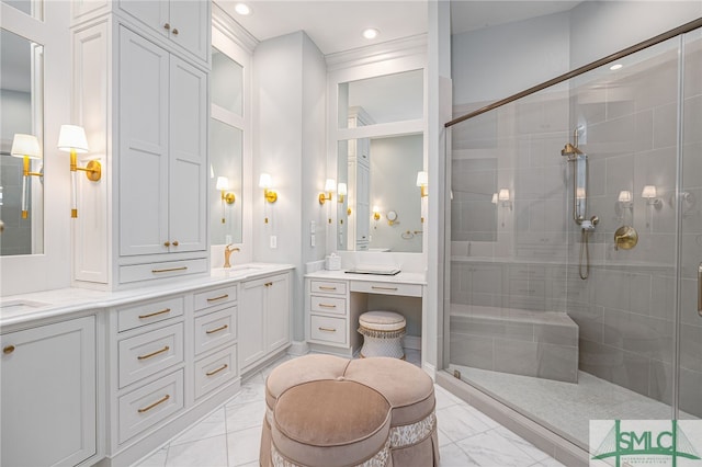 bathroom with vanity and a shower with door