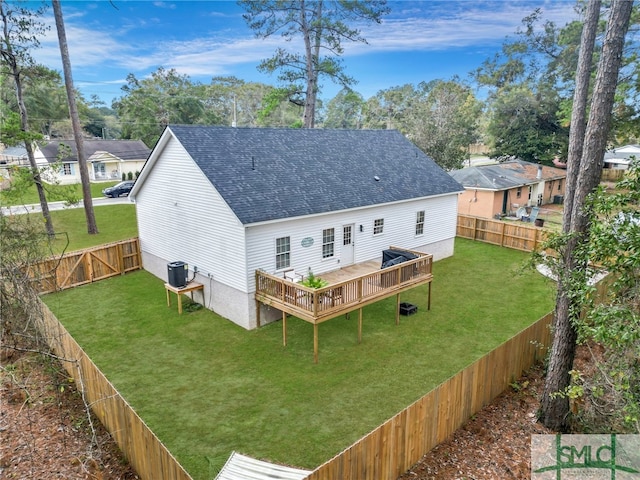 back of house featuring a lawn, cooling unit, and a deck