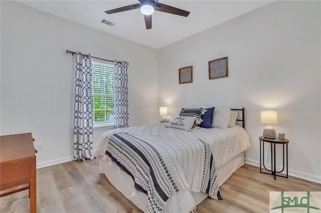 bedroom featuring light hardwood / wood-style floors and ceiling fan